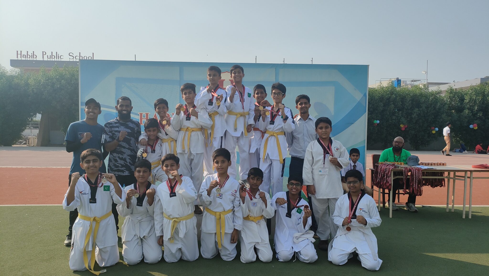 Students holding artwork at Habib Public School